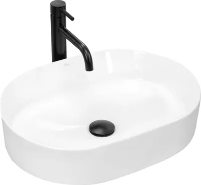 A white oval countertop sink with a black faucet and drain.