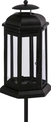 A black lantern with a stake, isolated on a white background.