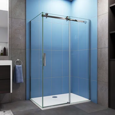 A modern bathroom with a glass shower enclosure.