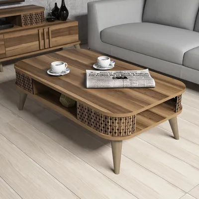 A coffee table with two cups of coffee and a newspaper, placed in a living room setting next to a sofa and a TV stand.