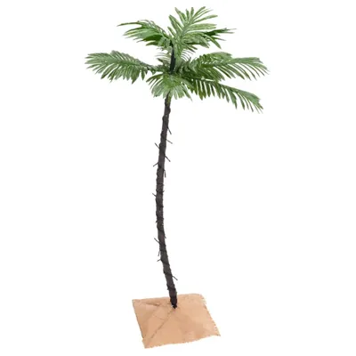 A single artificial palm tree on a white background.