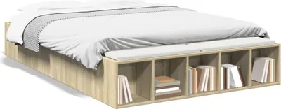 A bed frame with built-in storage compartments filled with books.