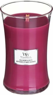 A WoodWick Wild Berry & Beets scented candle in a glass jar.