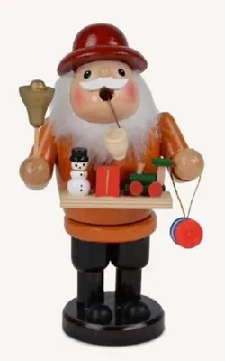 Räuchermännchen das mit roten Hut, einem orangefarbenen Mantel und einem weißen Bart geschmückt ist.