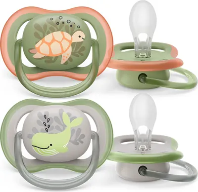 Two pairs of baby pacifiers with animal designs.