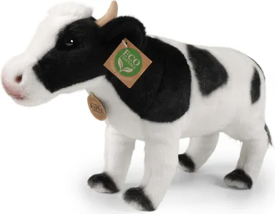 A plush toy cow with black and white markings, standing on a white background.