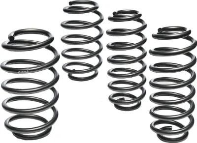 Four sets of car suspension springs are arranged in a group against a white background.