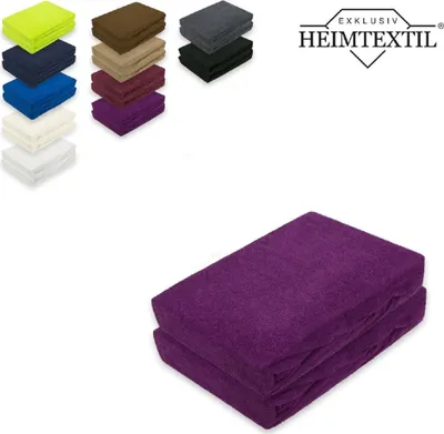 A stack of folded purple fitted sheets is shown on a white background, with smaller stacks of sheets in various colors and a logo in the upper right corner.