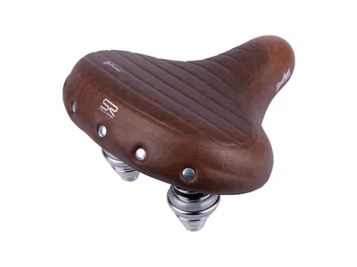 A brown bicycle saddle with silver springs, shown from a diagonal angle against a white background.