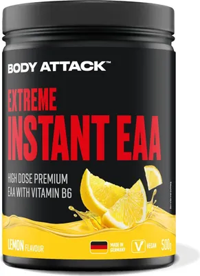 A black container of Body Attack Extreme Instant EAA with lemon flavor, featuring images of lemon slices and splashes of liquid.