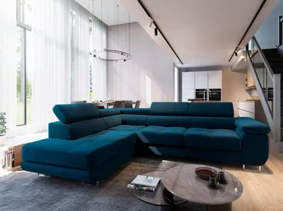 A modern living room with a large sectional sofa, dining area, and kitchen in the background.