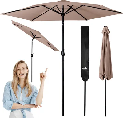 A woman is pointing at a patio umbrella and its accessories.