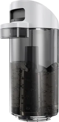 A close-up, side view of an automatic soap dispenser with a clear reservoir filled with dark liquid.