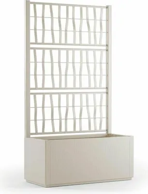 A white planter with a decorative trellis structure.