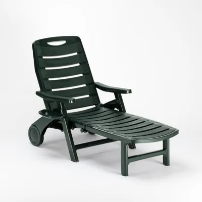 A dark green plastic sun lounger is shown against a white background.