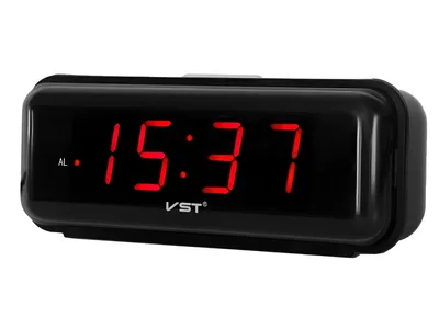 A black digital alarm clock with a red LED display showing the time.