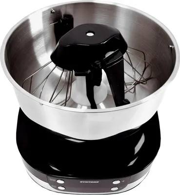 A close-up, high-angle view of a black and silver stand mixer with its whisk attachment inside the silver bowl.