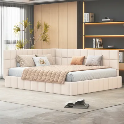 A modern bedroom with a beige upholstered bed and decorative pillows.