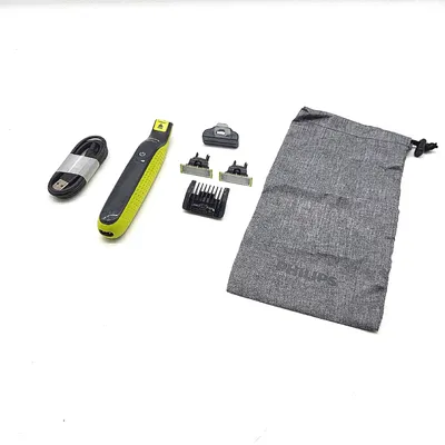 Produktbild von Philips OneBlade QP2724/30 - Elektronischer Bartschneider, Rasierer, 2x Original-Gesichtsklinge, 1x verstellbarer 5-in-1-Kamm 1x Softcase