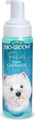 A bottle of Bio-Groom Facial Foam Cleanser for dogs, featuring a picture of a white dog on the label.