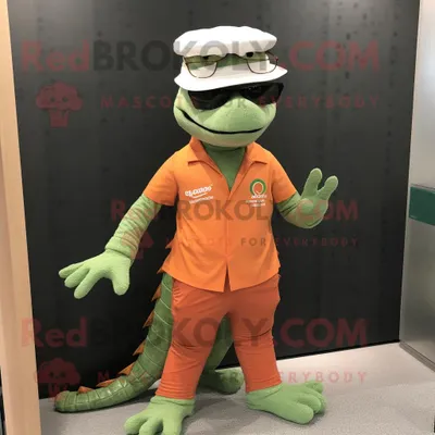 Produktbild von Pfirsich-Krokodil REDBROKOLY Maskottchen kostüm gekleidet mit einem grafischen T-Shirt und einer Brille