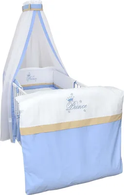 A baby crib set with a canopy and bedding, featuring a "Prince" theme.
