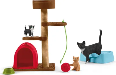 A toy cat tree with accessories, including cats, a red tent, a red ball, and food bowls.