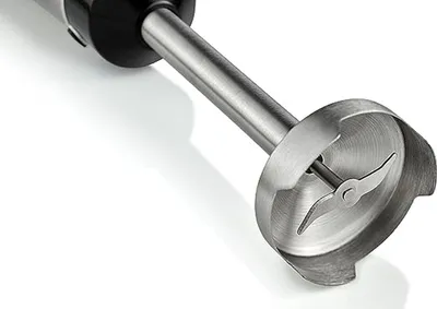 A close-up shot of the blending attachment of an immersion blender.