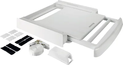 A white washing machine and dryer accessory kit is laid out on a white background.