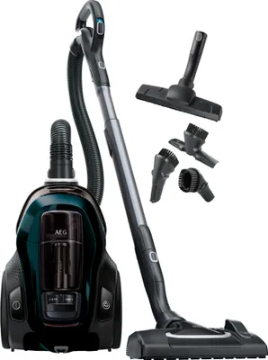 A vacuum cleaner with its accessories displayed against a white background.