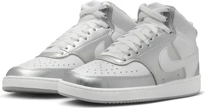 A pair of white and silver Nike Court Vision Mid sports shoes.