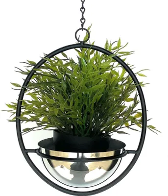A hanging planter with a green plant inside, suspended by a chain.