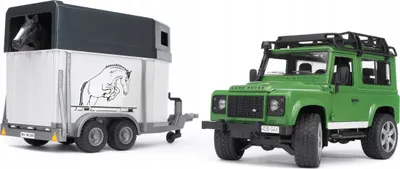 A toy Land Rover Defender and a toy horse trailer are shown side-by-side against a white background.