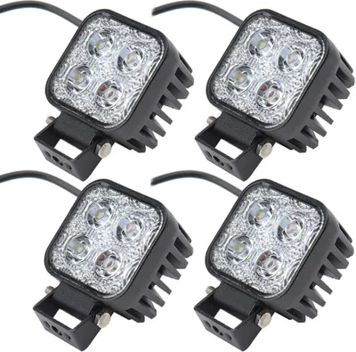 Four square LED lights with black housing and metal brackets are arranged in a grid on a white background.