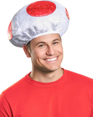 A man wearing a red shirt and a Toad mushroom hat.