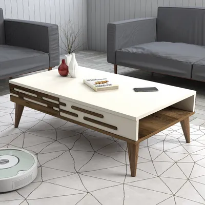 A modern living room scene with a coffee table, sofas, and a robot vacuum cleaner.