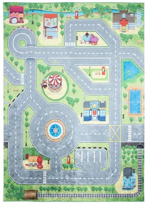 A colorful play mat depicting a city street scene with various buildings, a playground, a carousel, a fountain, a sports field, and a train track.