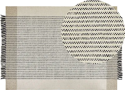 Produktbild von BELIANI Teppich Beige / Schwarz Wolle 140 x 200 cm Rechteckig Handgewebt Streifenmuster Kurzflor mit Fransen Boho Wohnzimmer Schlafzimmer Esszimmer