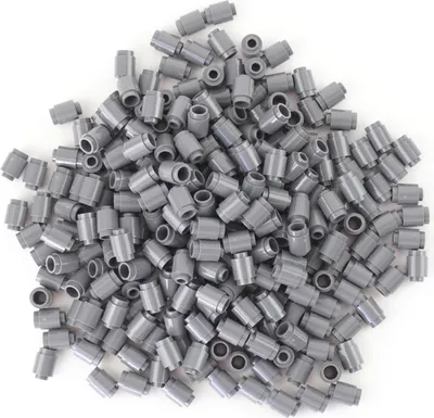 A pile of small, round, dark gray LEGO bricks.