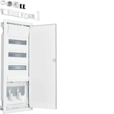 A white electrical distribution board with its door open, showing internal components and some accessories laid out above.