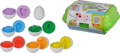 A collection of colorful shape-sorting eggs and their corresponding sorting containers, along with the product's packaging.