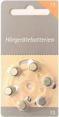 A blister pack of hearing aid batteries.