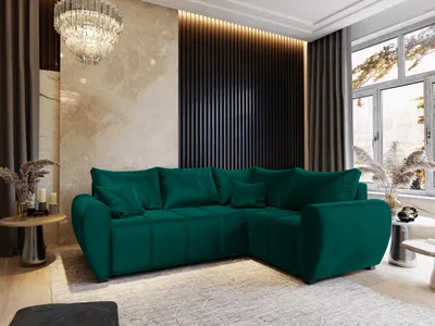 A luxurious living room with a large green sectional sofa, a modern wall panel, and a crystal chandelier.