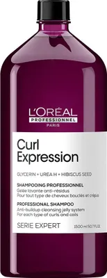 A bottle of L'Oréal Professionnel Curl Expression shampoo against a white background.