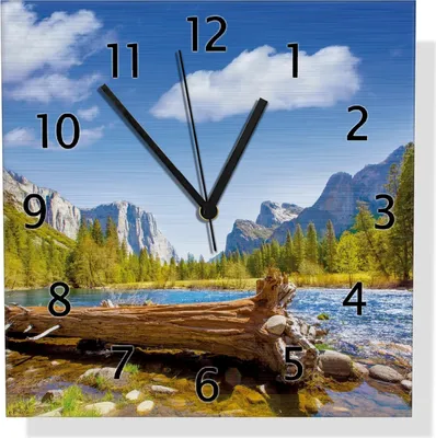Produktbild von Wallario Design Wanduhr Baumstamm im Fluss zwischen Bergen und Wäldern aus Aluverbund, Größe 30 x 30 cm