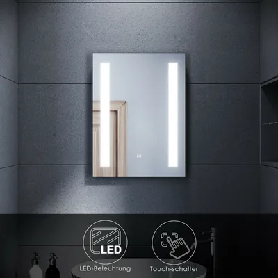 A modern bathroom mirror with integrated LED lighting, displayed against a textured gray tile wall. The bottom of the image features icons and text highlighting product features.