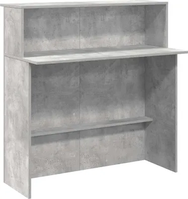 A front view of a concrete-effect reception desk.