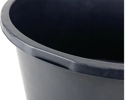Close-up view of the rim of a black mortar tub.