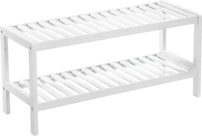 A white, two-tiered shoe rack made of slatted wood.