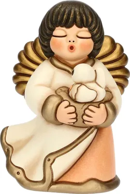 A ceramic angel figurine holding a small bird.
